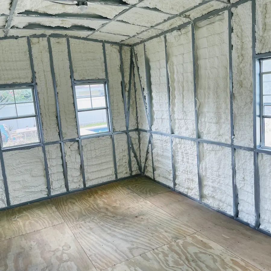 Closed-cell spray foam insulation applied to wall cavities in a residential project in Dighton